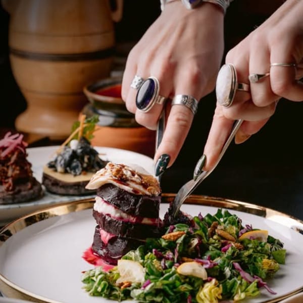 Plated beet stack with harvest salad